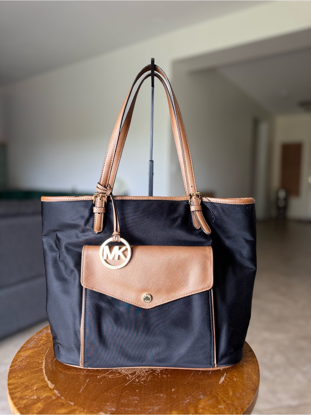 Michael Kors Black Tote with Tan Leather Trim and MK Charm